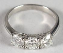 A PLATINUM AND DIAMOND THREE-STONE RING 1.53CT.