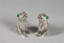 A PAIR OF FROG SALT AND PEPPERS.