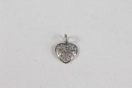 A SMALL GOLD AND DIAMOND HEART PENDANT.