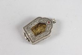 A SMALL TRAVELLING TIBETAN ICON. 2ins x 1.5ins.