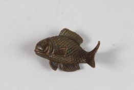 A SMALL JAPANESE BRONZE CARP. 2ins long.