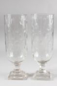 A GOOD PAIR OF GLASS HURRICANE LAMPS. 13.5ins high.