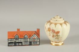 A ROYAL WORCESTER BLUSH IVORY JAR AND COVER, painted with flowers; together with a Willow Art