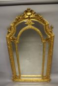 A GOOD LARGE LOUIS XVITH STYLE GILTWOOD UPRIGHT MIRROR with garlands, cupids and shells. 6ft 10ins