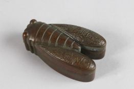 A BRONZE LOCUST BOX AND COVER. 3ins high.