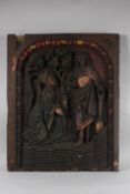 AN 18TH CENTURY CARVED WOODEN PANEL depicting in relief, MARY MAGDALENE and CHRIST. 29ins x 23ins.