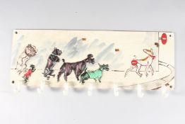 A PAINTED CAST IRON DOG CLOTHES HOOK. 19ins high.