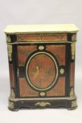 A MARBLE TOP BOULLE CABINET with long frieze drawer over a panel door, with oval gilt metal