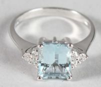 AN 18CT WHITE GOLD, AQUAMARINE AND DIAMOND RING.
