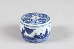 A CHINESE BLUE AND WHITE CIRCULAR INK POT, the side with figures. 2.75ins diameter x 2ins high.