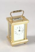 A SMALL ANGELUS BRASS CARRIAGE CLOCK. 3ins high in a folding leather case.