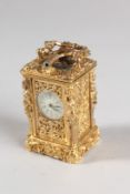 A GOOD MINIATURE CAST METAL CARRIAGE CLOCK, the sides with female figures. 2.5ins high.