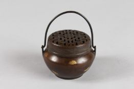 A SMALL CHINESE GOLD SPLASH CIRCULAR CENSER AND COVER with handle. 2.75ins diameter.