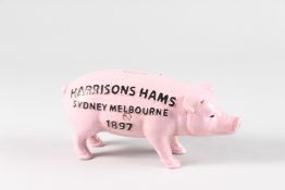 A PAINTED CAST IRON PIG MONEY BOX. 7.5ins high.