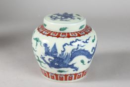 A CHINESE WUCAI PORCELAIN GINGER JAR AND COVER. 12cms high.
