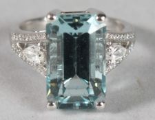 AN 18CT WHITE GOLD, AQUAMARINE 7.70CT RING, with diamond set shoulders.