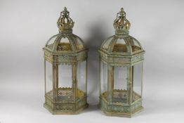 A PAIR OF CROWN TOP METAL AND GLASS OCTAGONAL LANTERNS. 24ins high.