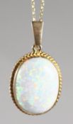 A 9CT GOLD OPAL PENDANT on chain.