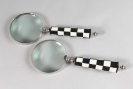 THREE MAGNIFYING GLASSES with checked handles.
