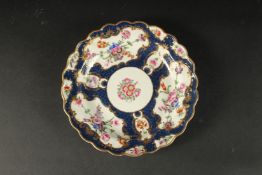 A GOOD FIRST PERIOD WORCESTER DISH, rich blue and floral body. Square mark in blue. 7.5ins