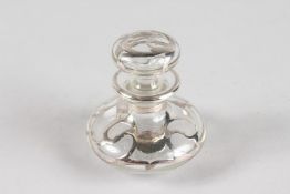 A SMALL SILVER OVERLAY SCENT BOTTLE AND STOPPER.