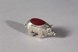 A SILVER NOVELTY HOG PIN CUSHION.