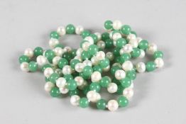 A LONG STRING OF JADE AND PEARLS. 4ft long.