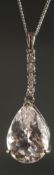 AN 18CT WHITE GOLD PENDANT set with pear shaped kunzite and diamond set bale on a silver chain,