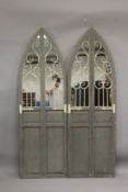 A PAIR OF ARCH TOP MIRRORED PANELS. 5ft 9ins high x 1ft 10ins wide.