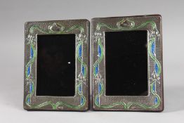 A PAIR OF SILVER AND ENAMEL BUTTERFLY PHOTOGRAPH FRAMES.