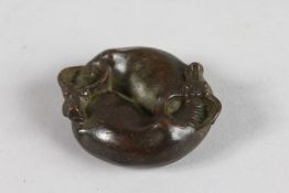A JAPANESE BRONZE CIRCULAR WEIGHTS, TWO OXEN. 2ins diameter.