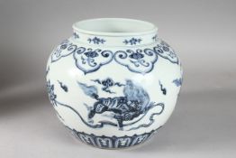 A CHINESE BLUE AND WHITE PORCELAIN KYLIN JAR. 20cms high.
