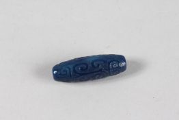 A BLUE AGATE DZI BEAD.