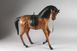A LARGE LEATHER HORSE. 22ins high.