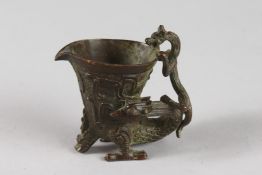 A JAPANESE BRONZE LIBATION CUP. 3ins high.