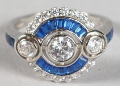 A SILVER CZ FAUX SAPPHIRE RING.