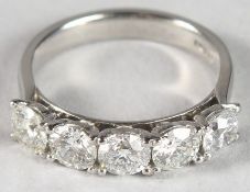 A PLATINUM AND DIAMOND FIVE-STONE RING 1.68CT.