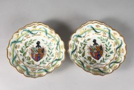 A RARE PAIR OF CHELSEA SHAPED ARMORIAL DISHES. 8ins.