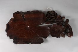 A CARVED HARDWOOD LOTUS AND LILY PAD WITH FROG DISH. 22ins long x 12ins wide.
