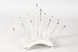 A CHRISTOPHER DRESSER DESIGN SIX-DIVISION TOAST RACK.