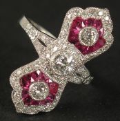 A PLATINUM EDWARDIAN-STYLE RUBY AND DIAMOND PINCHED DESIGN RING. Central old-cut diamond and two