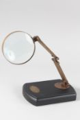 A MAGNIFYING GLASS on a stand.