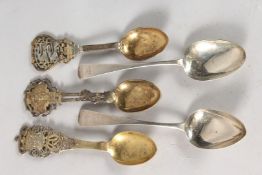 THREE SILVER GILT CONTINENTAL SPOONS AND TWO GEORGE III DESSERT SPOONS.