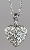AN 18CT WHITE GOLD AND DIAMOND HEART SHAPED PENDANT AND FINE CHAIN, 0.75CT.