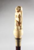 A WALKING STICK with carved bone handle of a nude.