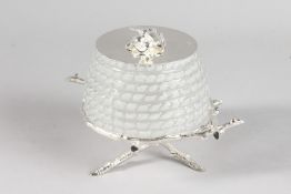 A GLASS AND PLATE HONEY POT on a stand.