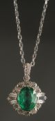 A CERTIFICATED 18CT WHITE GOLD PENDANT set with oval-cut emerald and a halo of RBC and tapered