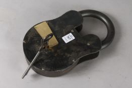 A LARGE METAL LOCK AND KEY.