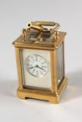 A GOOD MINIATURE SILVERED DIAL CARRIAGE CLOCK. 2.25ins high.
