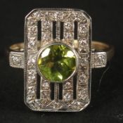 A 9CT WHITE AND YELLOW GOLD VINTAGE-STYLE PERIDOT AND DIAMOND RING. Peridot 0.85ct. Diamonds 0.